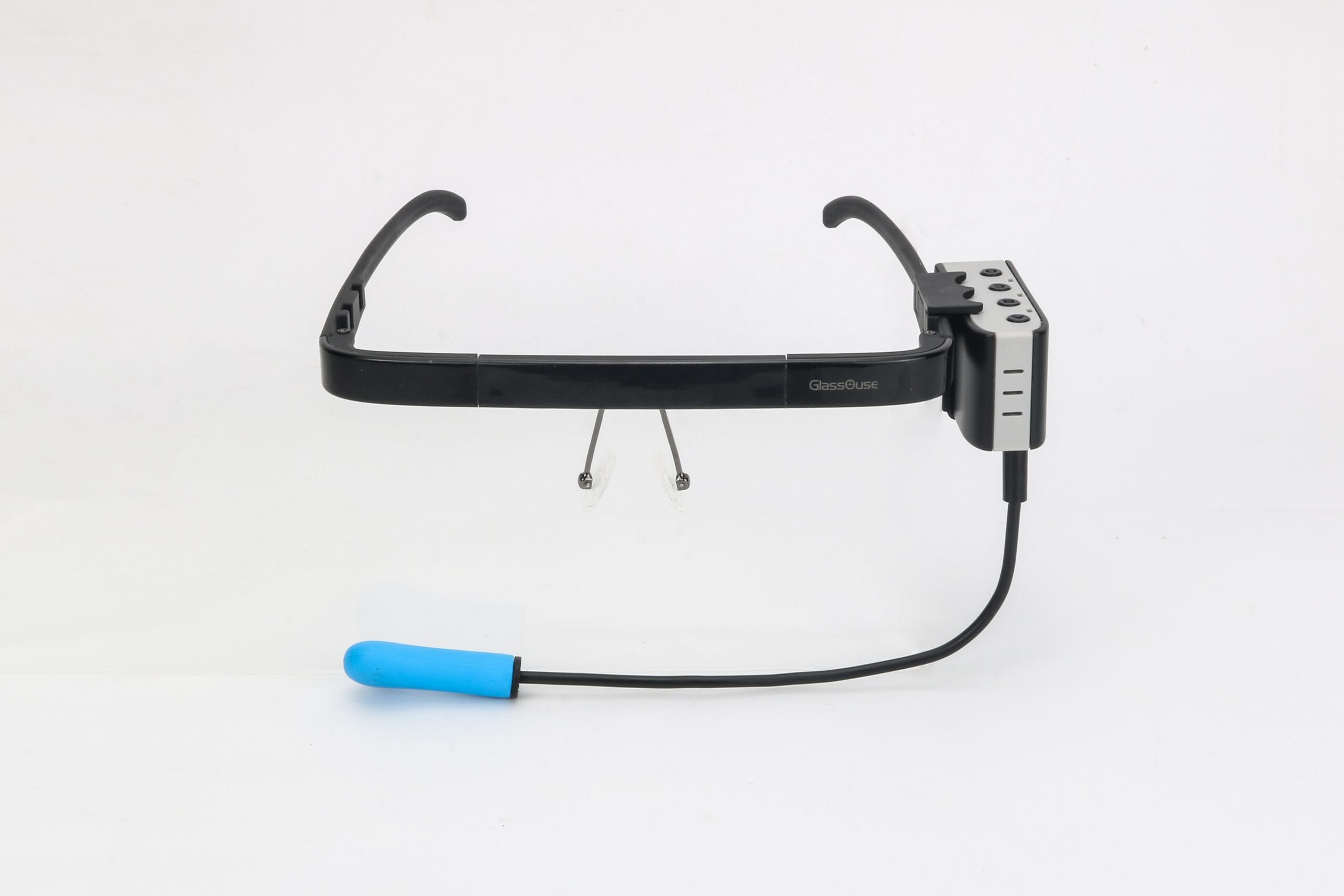 Glassouse-Gerät, das etwas aussieht wie eine Brille zum auf dem Kopf tragen. Zusätzlich ein blauer Beiss-Aufsatz.